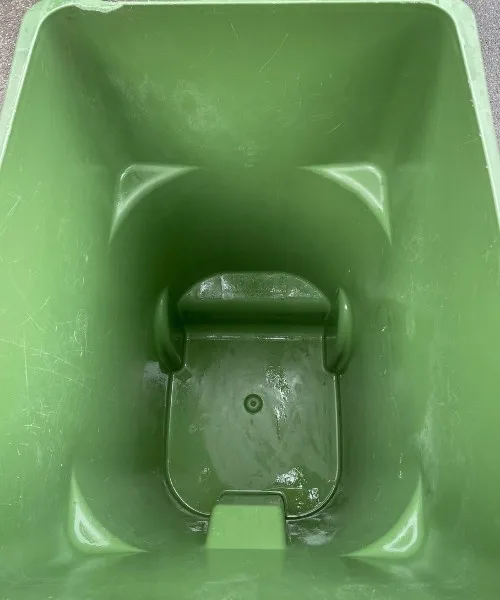 Pristine clean green garden waste bin after professional cleaning